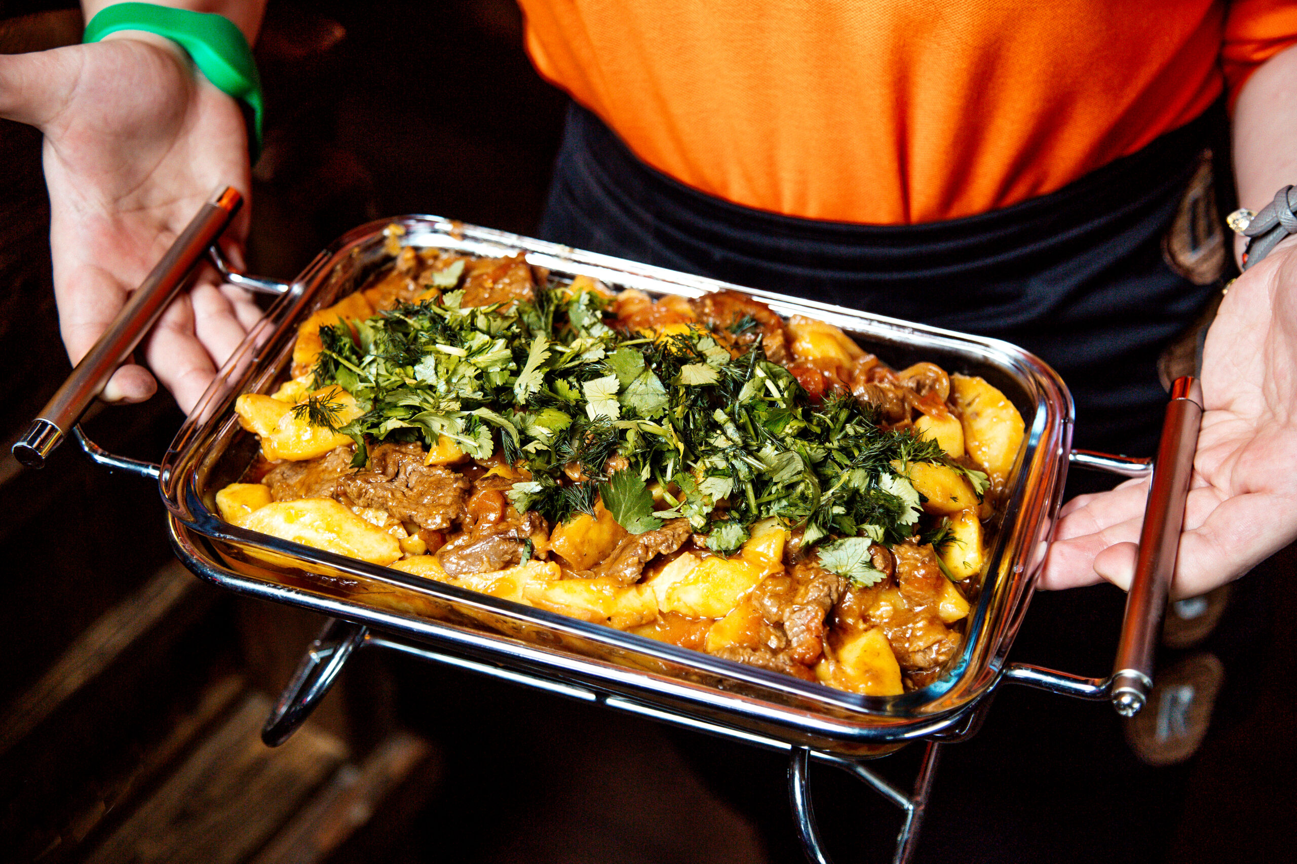 fried meat with potato and topped with herbs